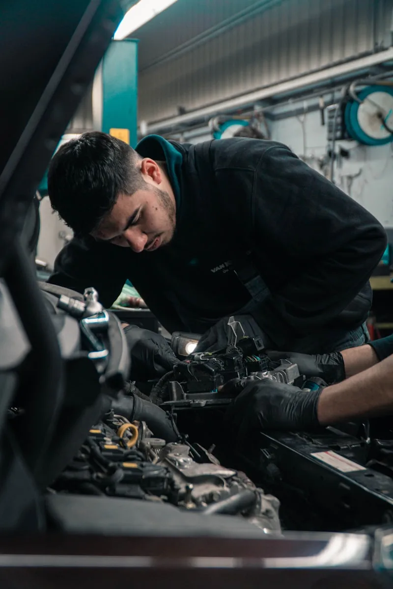 Mechanic performing engine maintenance